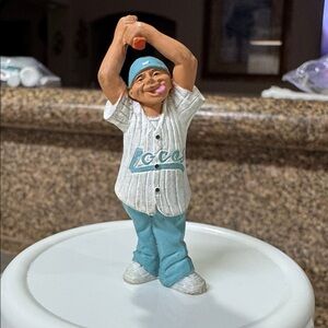 This is a "Switch Happy" figurine from the Lil' Locsters Series 1 collection.